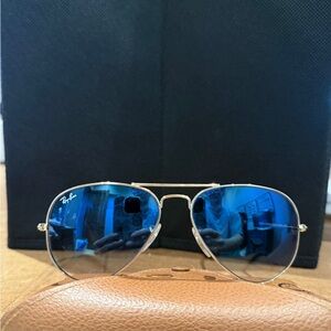 Ray-Ban Aviator Sunglasses with gold frames and blue gradient lenses